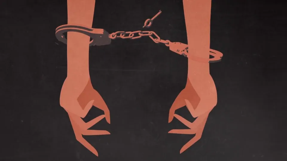 Two restrained hands with handcuffs