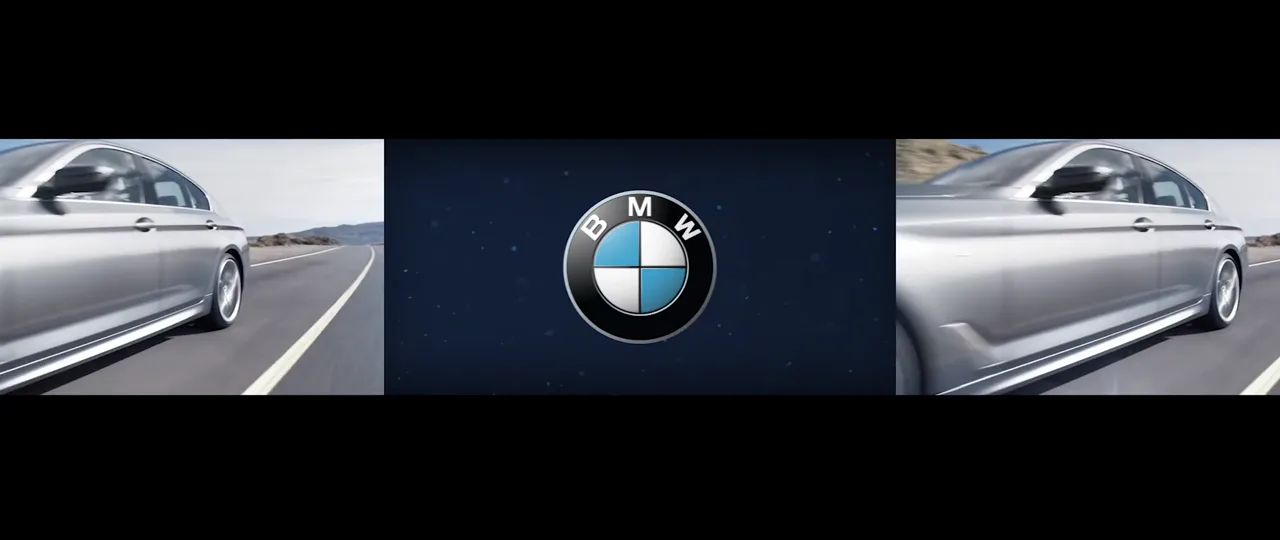 BMW 5 Series in motion across a panoramic screen