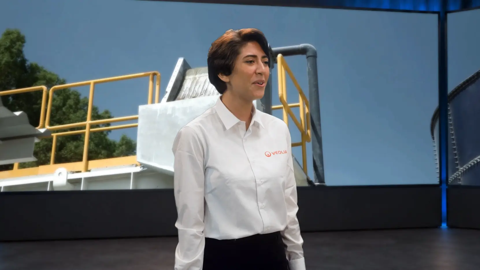 Veolia performer in a medium close shot against environmental infrastructure
